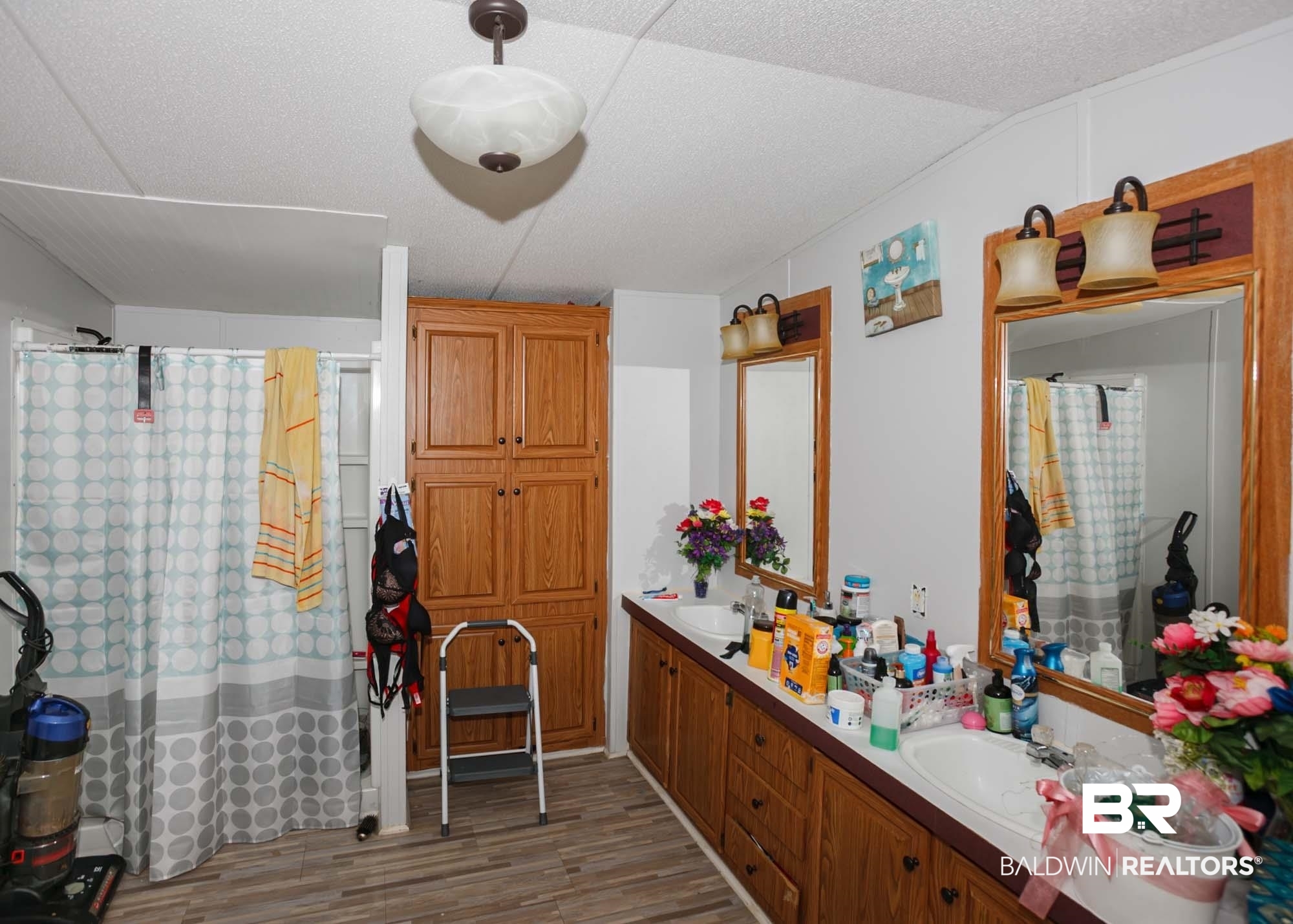 14005 County Road 49 Foley, AL 36535 - Photo 20 of 38 Full bathroom with wood finished floors, double vanity, and a shower with shower curtain