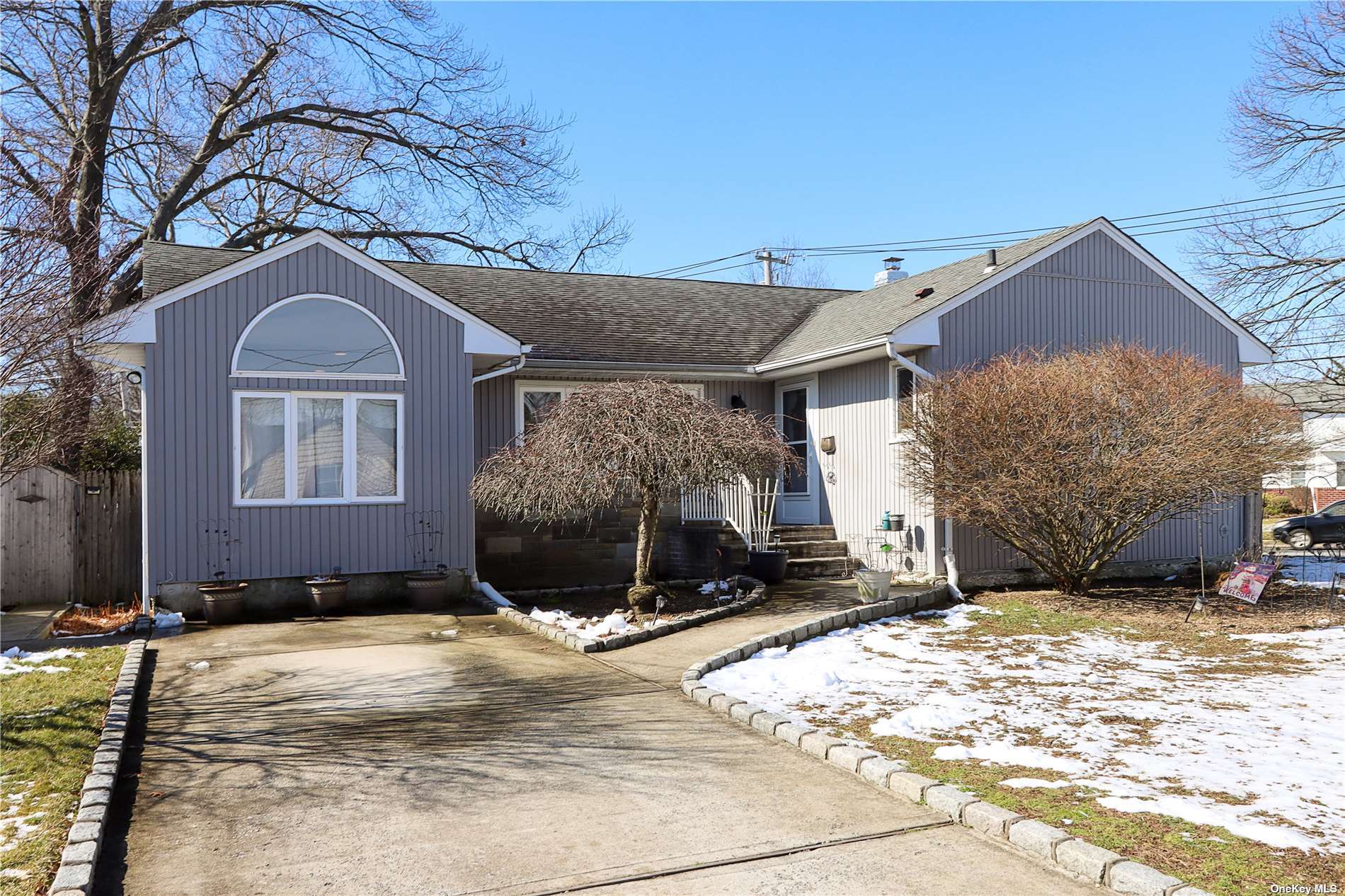 1476 North Meadow Road Merrick, NY 11566 - Photo 1 of 1 a front view of a house with a yard
