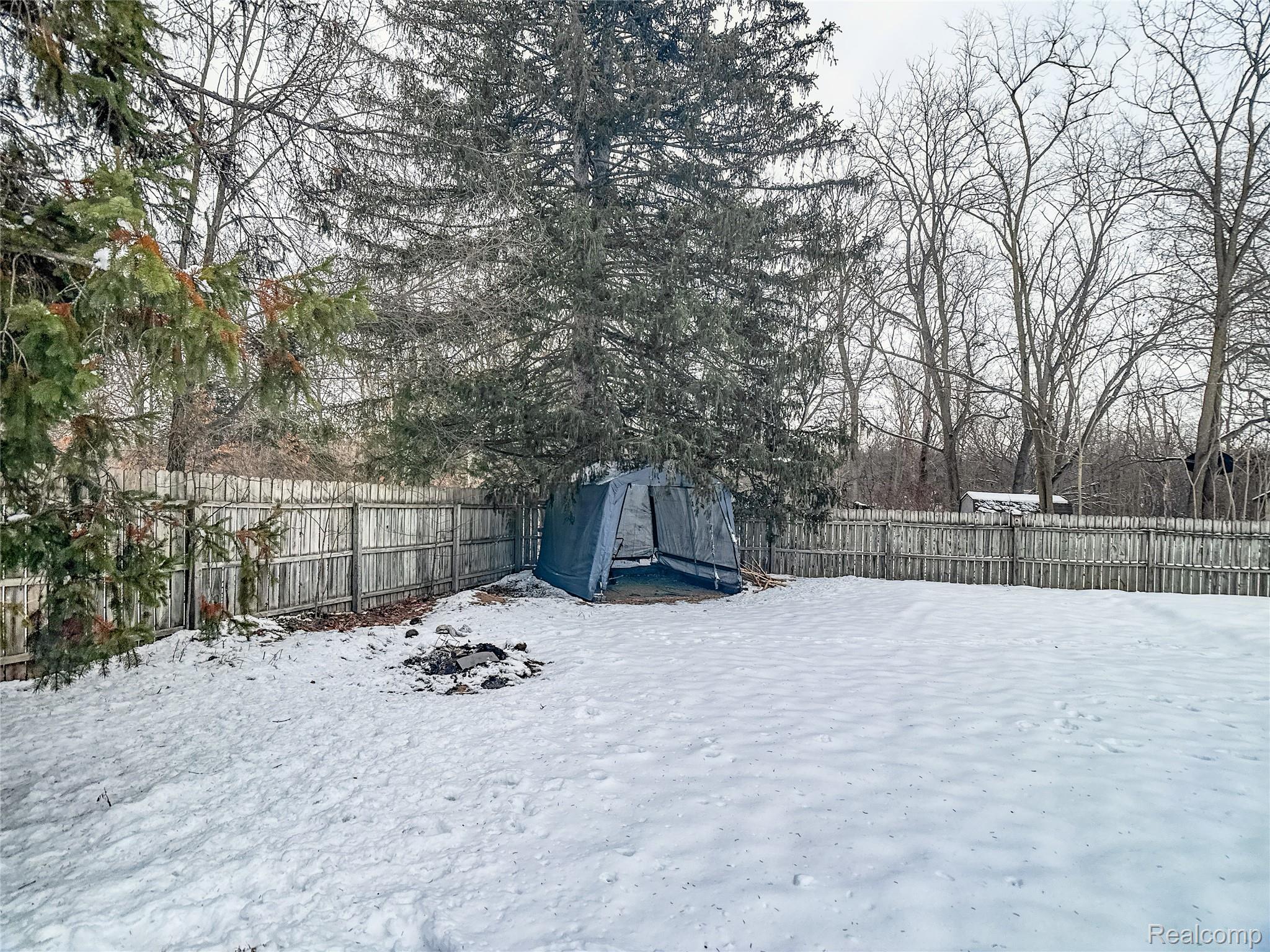 12034 North Seymour Road Montrose, MI 48457 - Photo 37 of 56 Yard covered in snow featuring a fenced backyard