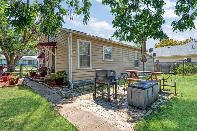 a view of a backyard with sitting area