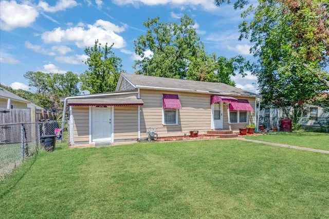 a house view with a sitting space and garden