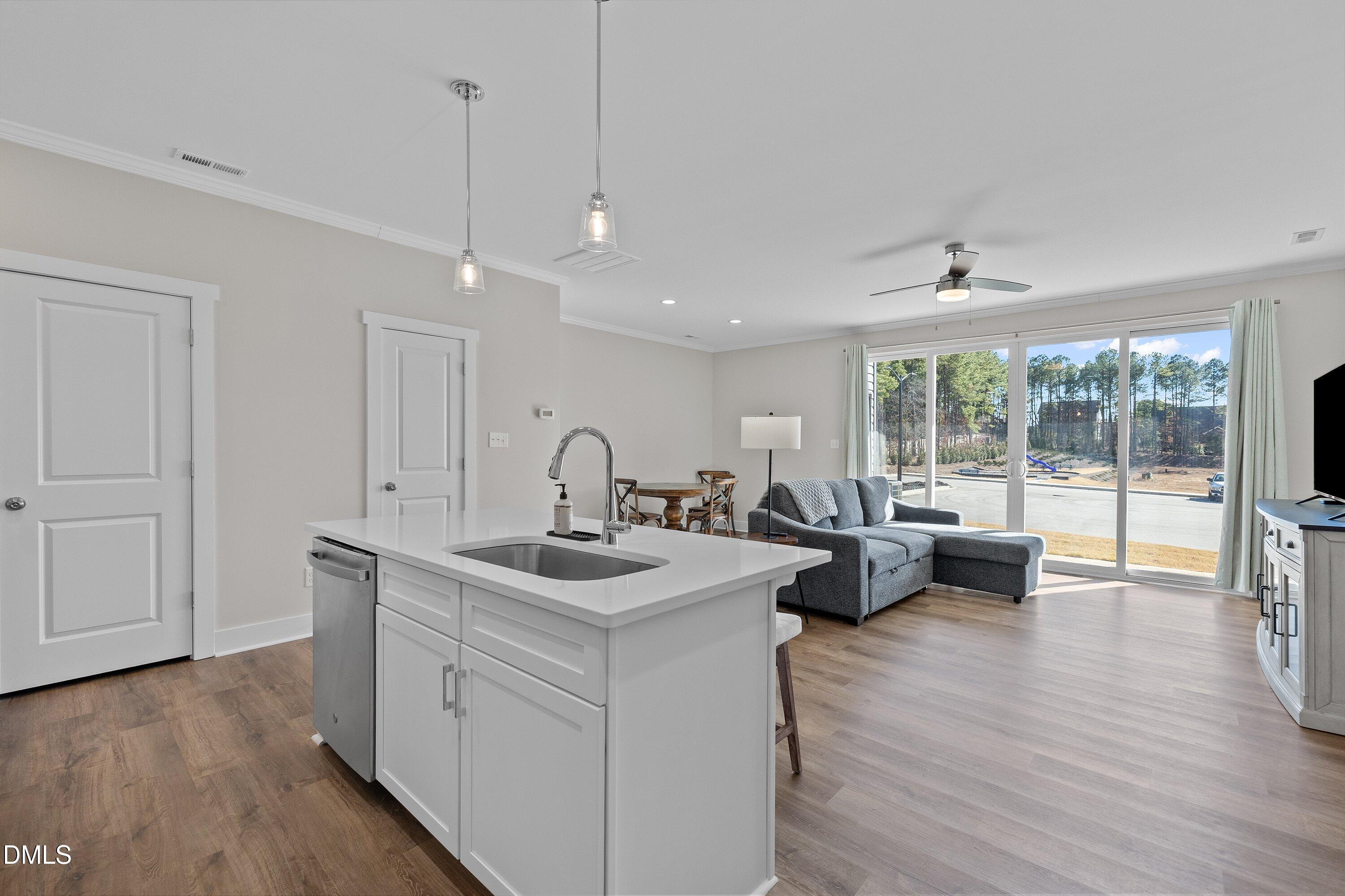 718 Jamescroft Way Rolesville, NC 27571 - Photo 13 of 40 a view of living room with granite countertop furniture and wooden floor