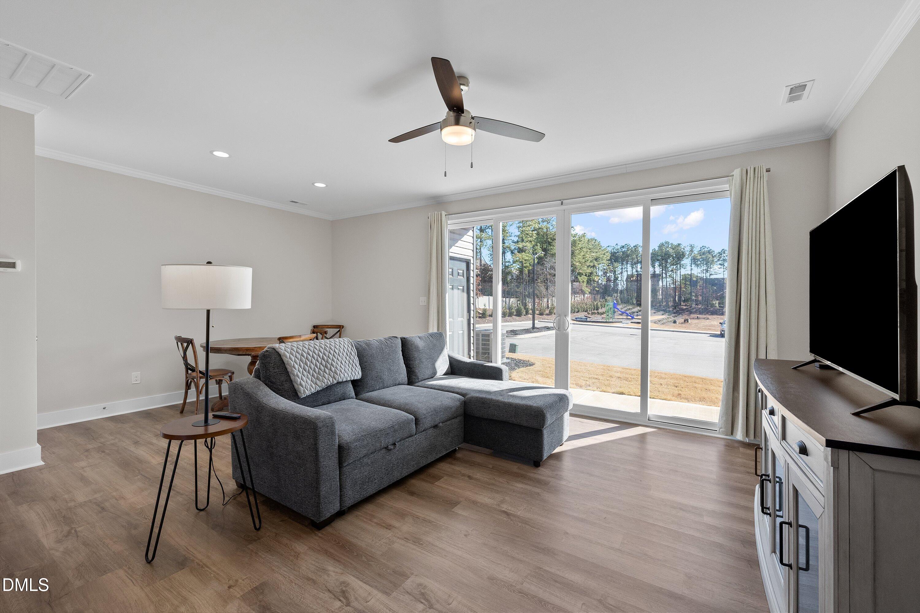 718 Jamescroft Way Rolesville, NC 27571 - Photo 17 of 40 a living room with furniture and a flat screen tv