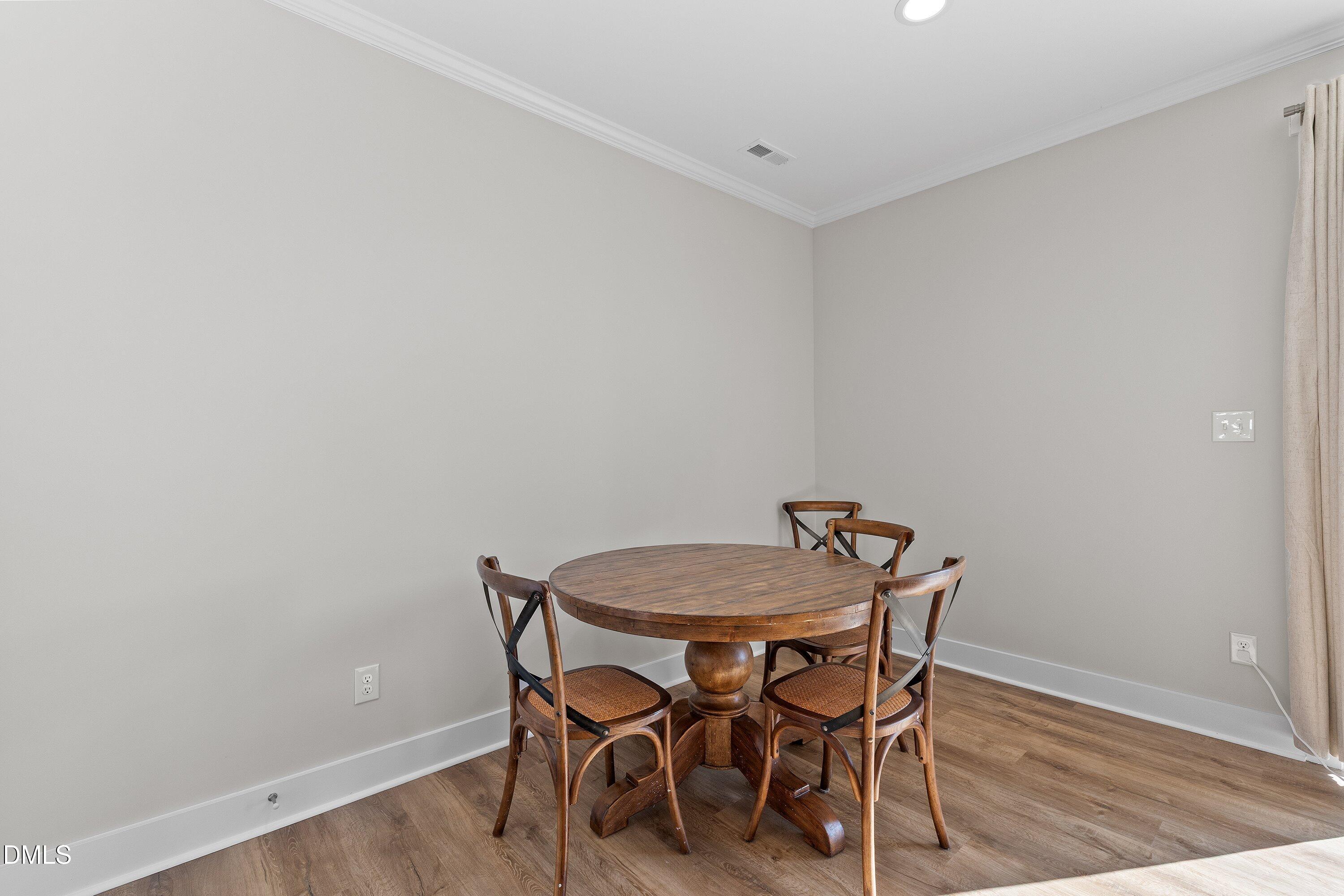 718 Jamescroft Way Rolesville, NC 27571 - Photo 22 of 40 a view of a room with a table and chairs