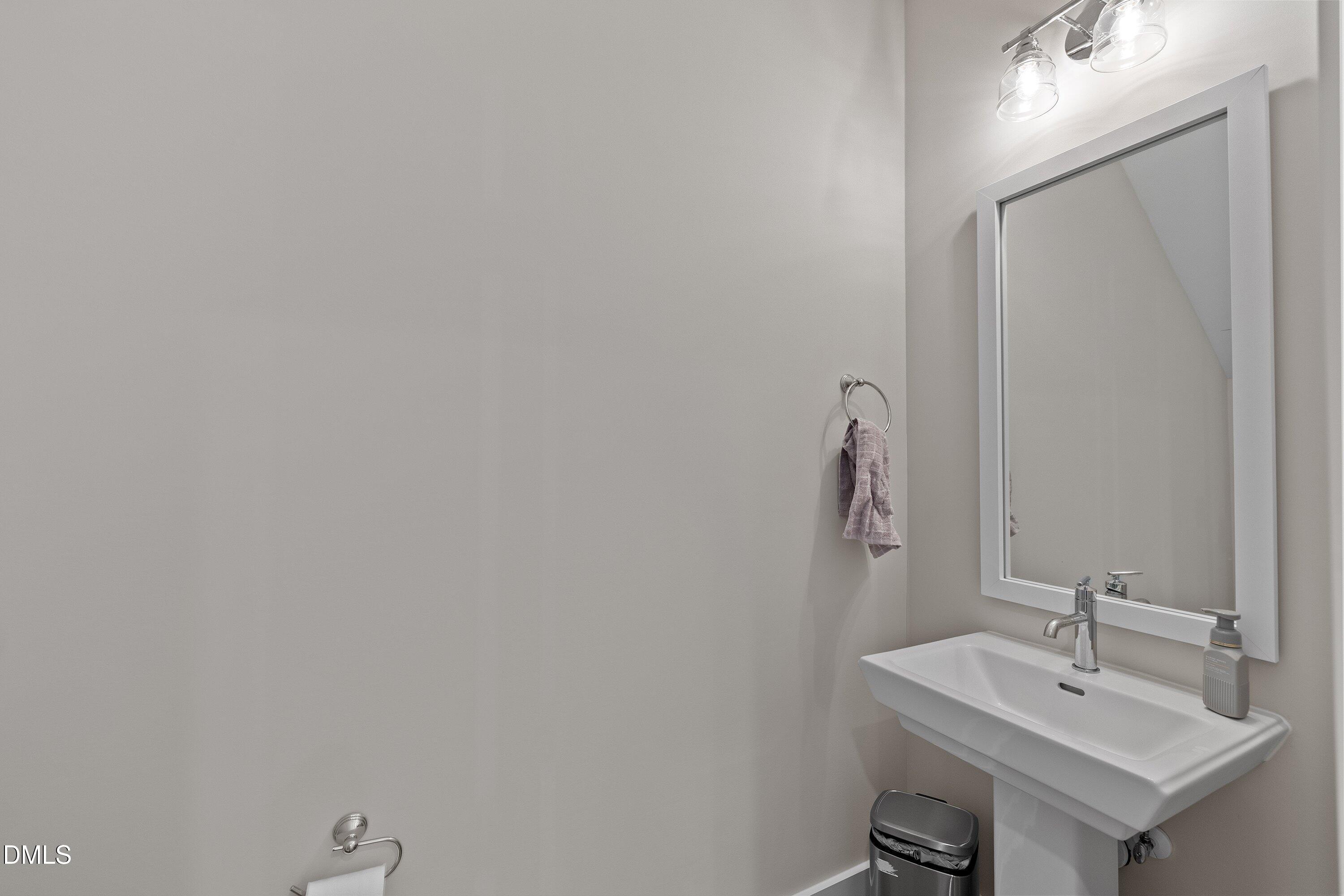 718 Jamescroft Way Rolesville, NC 27571 - Photo 23 of 40 a bathroom with a sink and a mirror