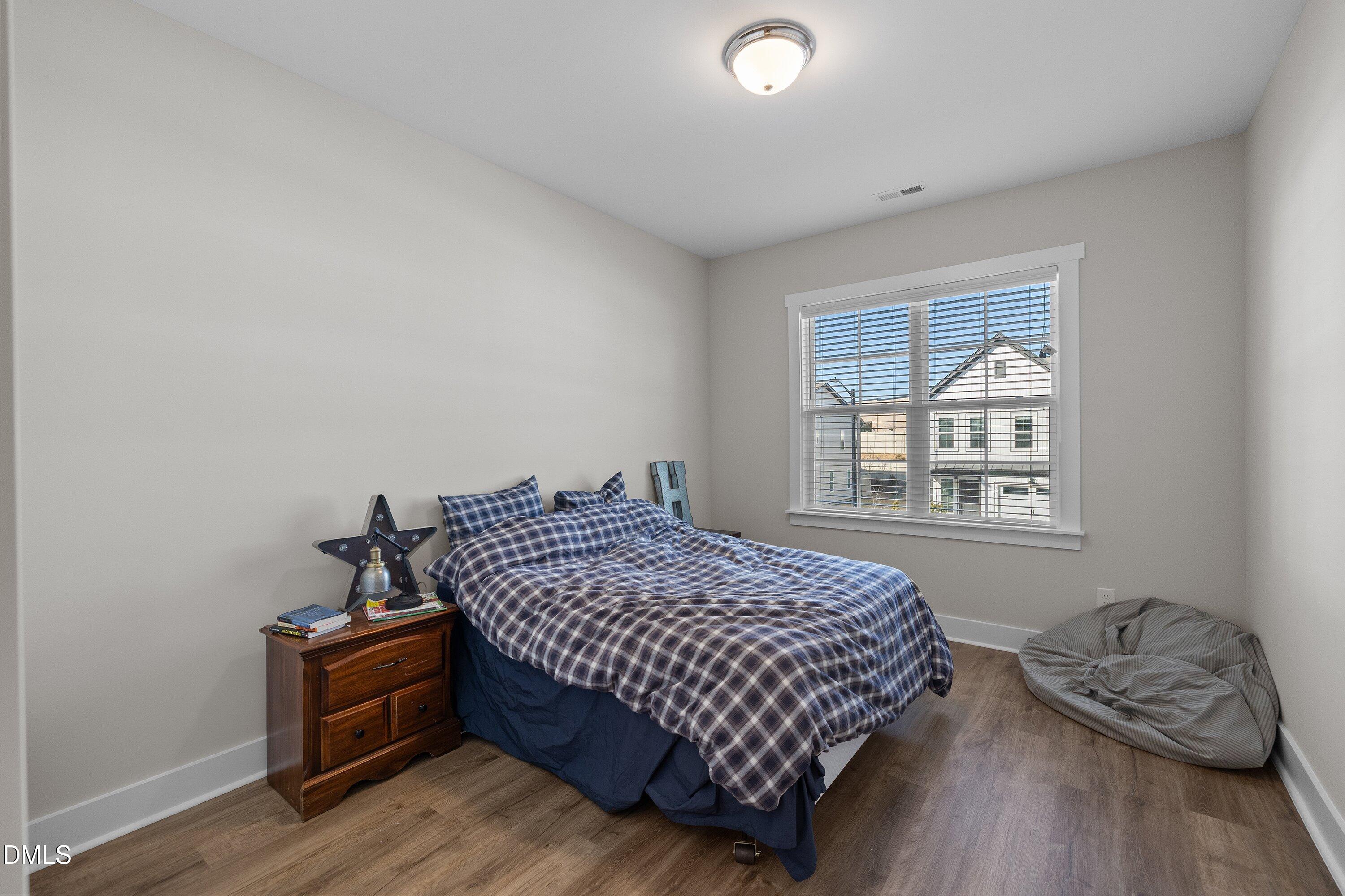 718 Jamescroft Way Rolesville, NC 27571 - Photo 29 of 40 a bedroom with a bed and a window