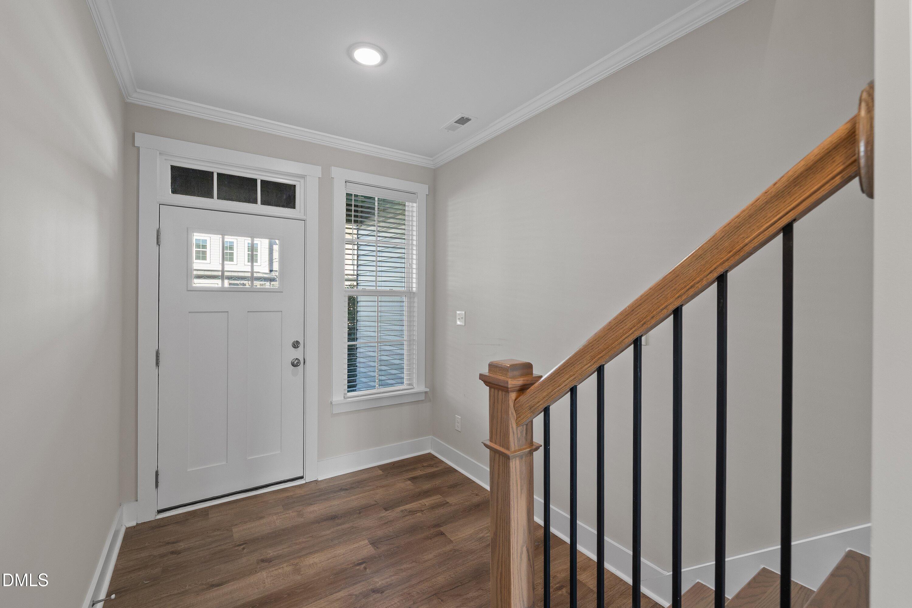 718 Jamescroft Way Rolesville, NC 27571 - Photo 6 of 40 a view of an entryway with wooden floor and stairs