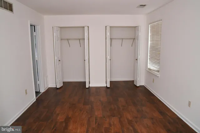 a view of house with a yard and deck