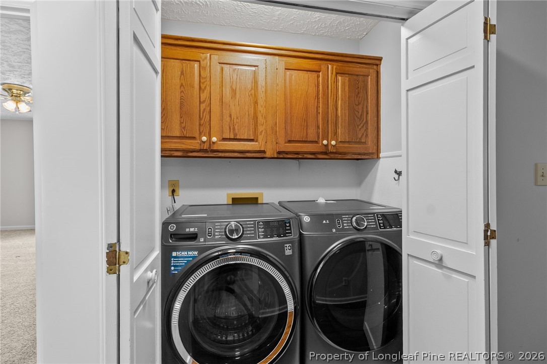 7756 Dragonhead Road Fayetteville, NC 28311 - Photo 26 of 42 a utility room with dryer and washer