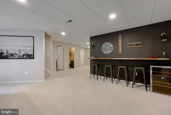 a view of a livingroom with furniture and closet