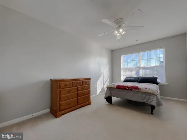 a bed room with a bed and a window