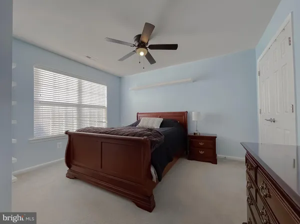 a bathroom with a sink toilet and mirror
