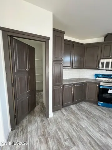 a kitchen with stainless steel appliances a refrigerator and a sink