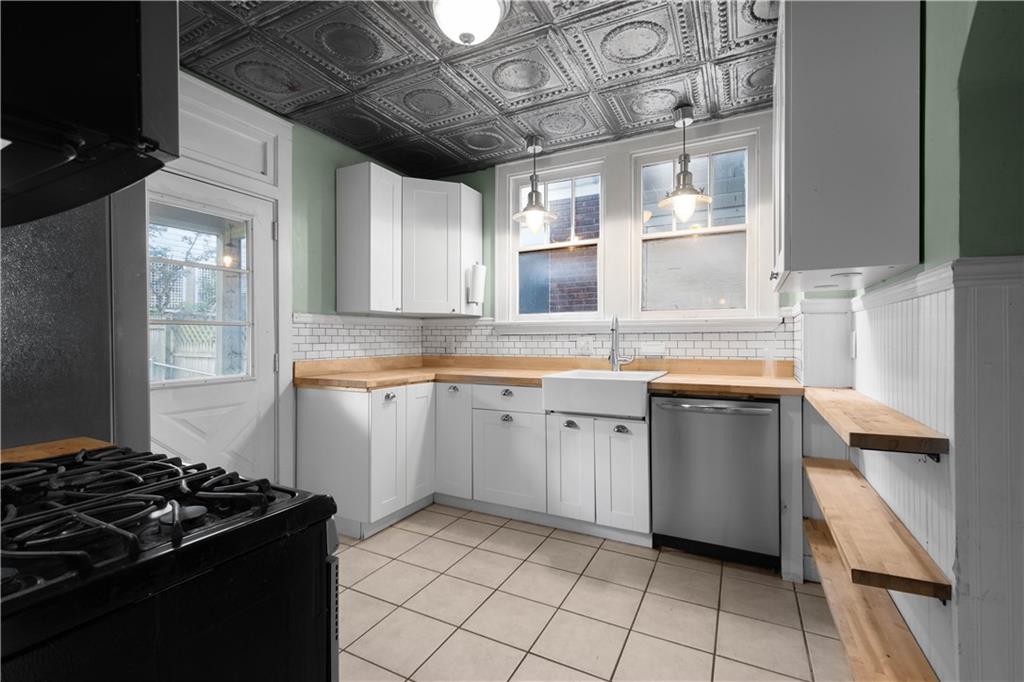 808 5th Avenue Coraopolis, PA 15108 - Photo 12 of 30 a kitchen with granite countertop a stove and a sink