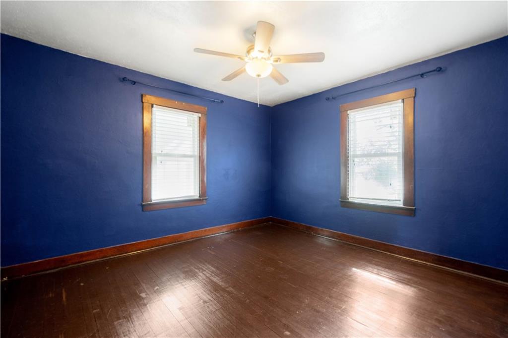 808 5th Avenue Coraopolis, PA 15108 - Photo 16 of 30 a view of an empty room with wooden floor and a window