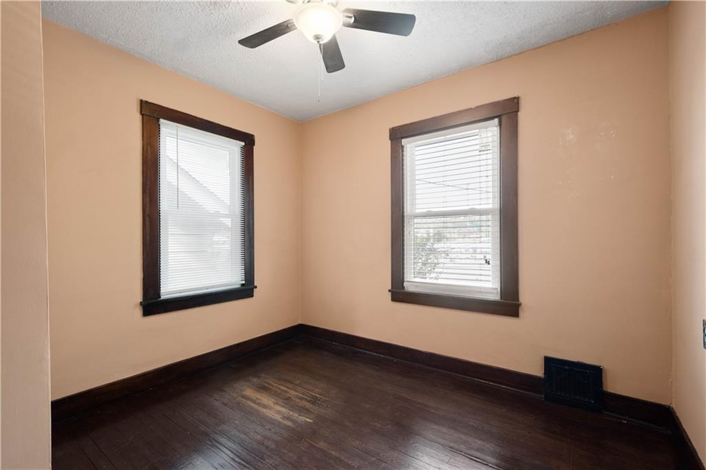 808 5th Avenue Coraopolis, PA 15108 - Photo 20 of 30 a view of an empty room with wooden floor and a window