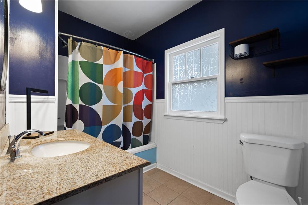 808 5th Avenue Coraopolis, PA 15108 - Photo 22 of 30 a bathroom with a granite countertop sink and a mirror