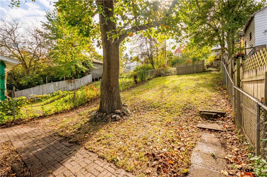 808 5th Avenue Coraopolis, PA 15108 - Photo 25 of 30 a view of a yard with wooden fence