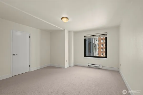 a view of an empty room with a window