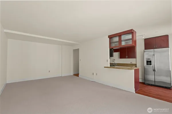 a view of an empty room with a window