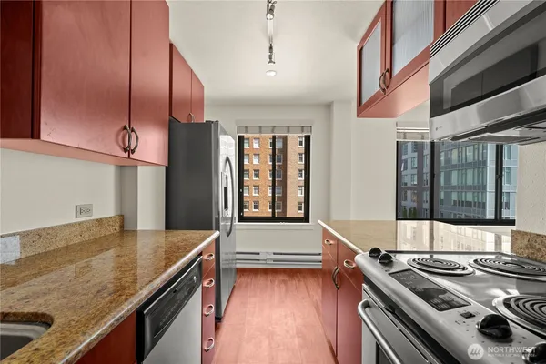 a kitchen with stove and a sink