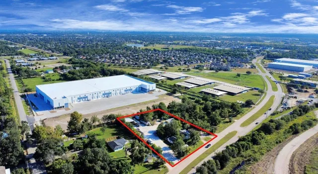 an aerial view of a house with a garden