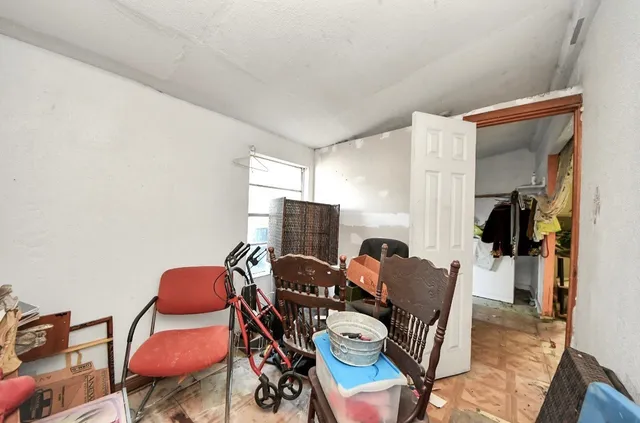 a view of a workspace with furniture and a couch