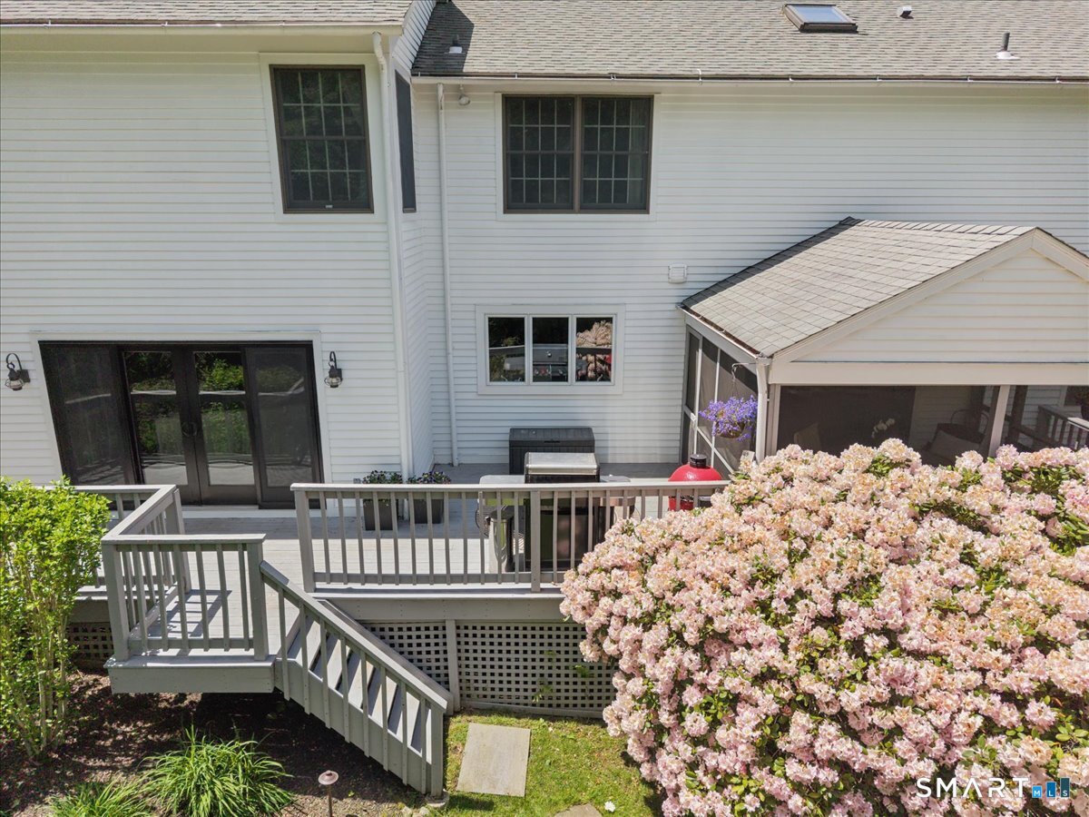 94 Vista Road Wilton, CT 06897 - Photo 33 of 38 a view of a house with wooden deck and furniture