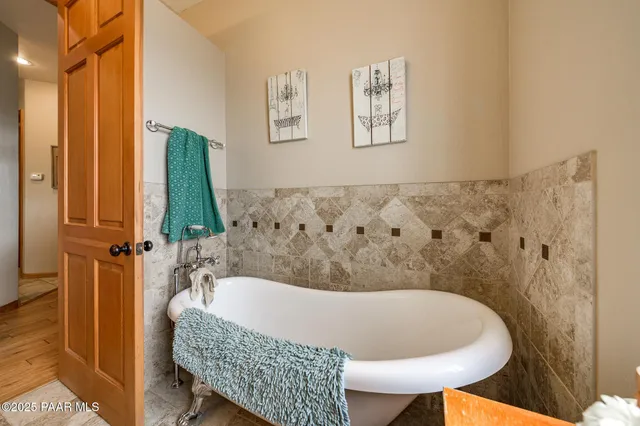 a bathroom with a sink mirror and vanity