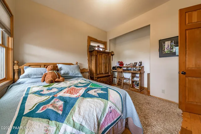 a bed room with a bed and a window