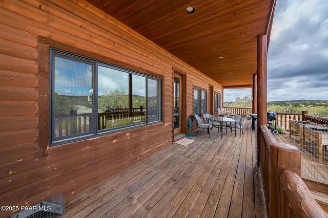 a view of a balcony with furniture