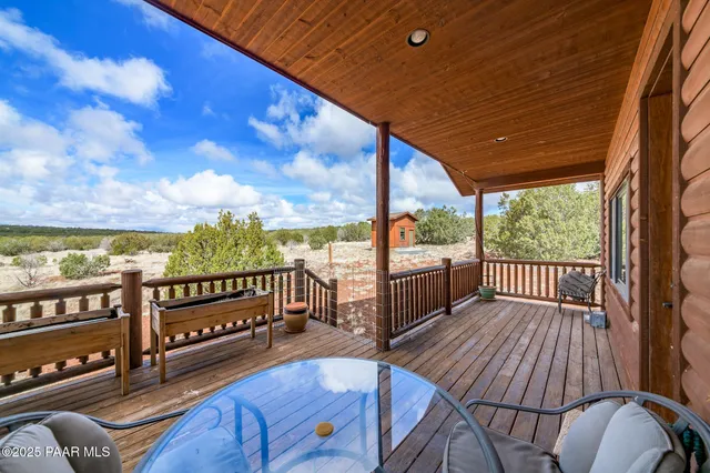 a view of a chairs and table in patio