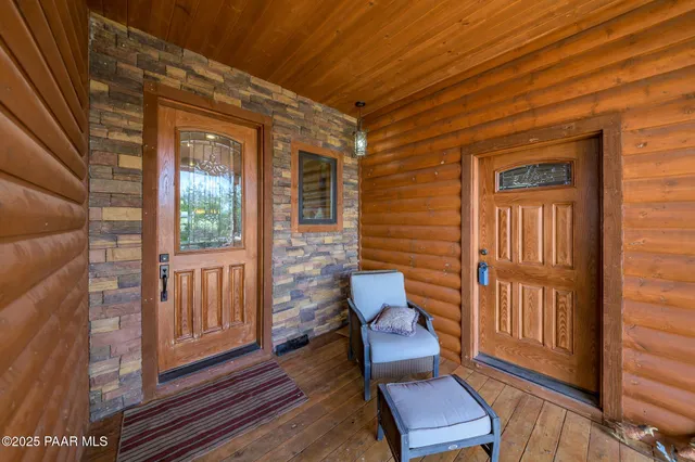 a view of a two chairs in the balcony