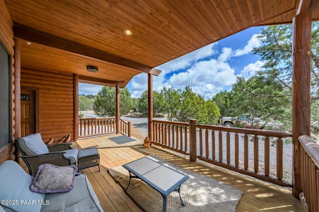 a view of a two chairs in the balcony