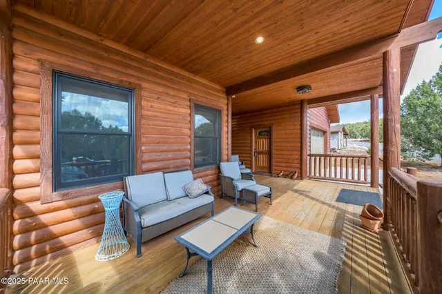 a outdoor living space with patio furniture and a window
