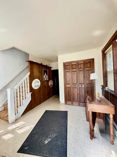 a view of a livingroom with furniture and window