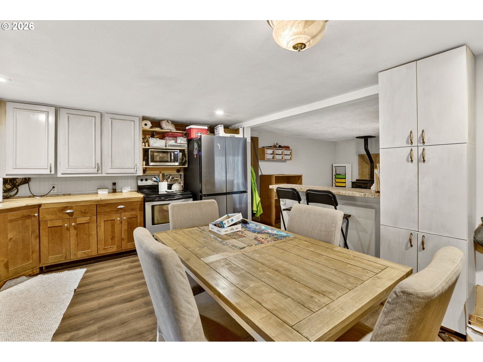 26200 Highway 211 Estacada, OR 97023 - Photo 11 of 24 a kitchen with refrigerator and cabinets