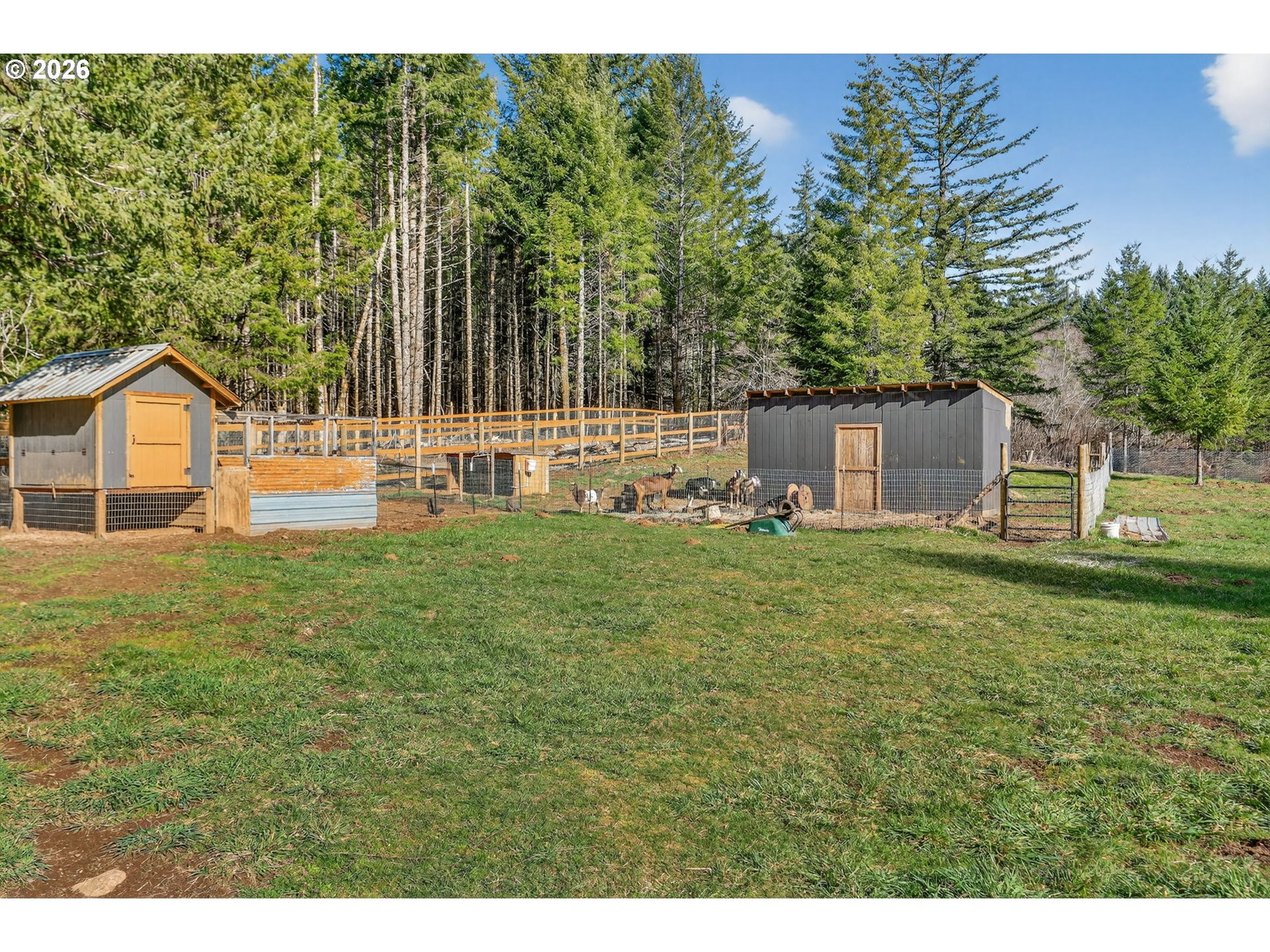 26200 Highway 211 Estacada, OR 97023 - Photo 17 of 24 a house view with garden space and trees