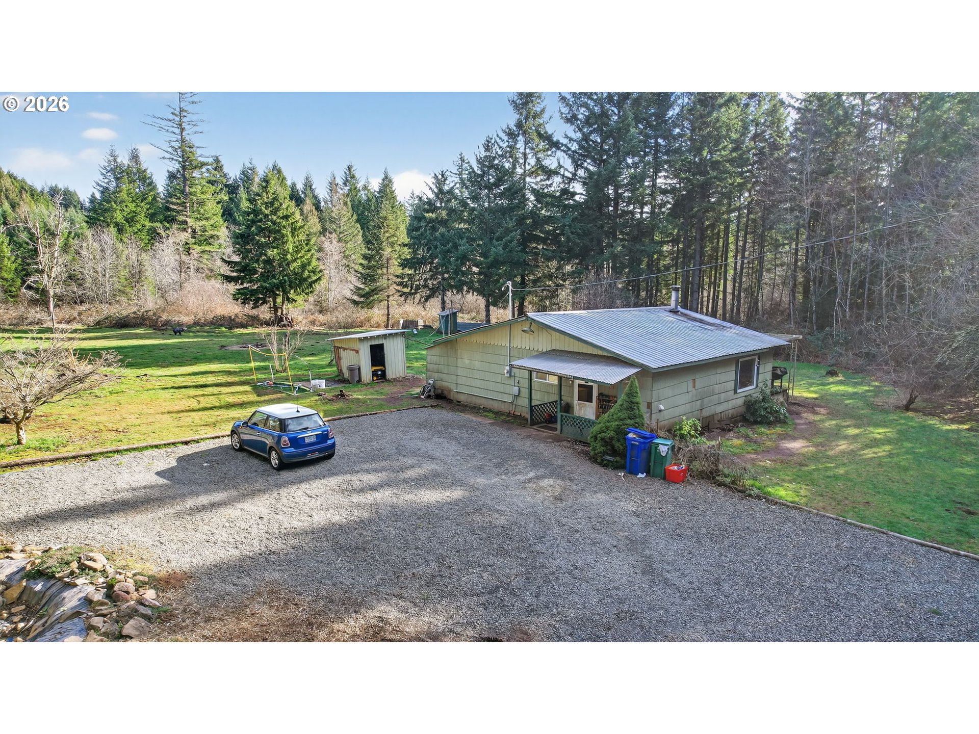 26200 Highway 211 Estacada, OR 97023 - Photo 20 of 24 a view of a house with backyard and swimming pool
