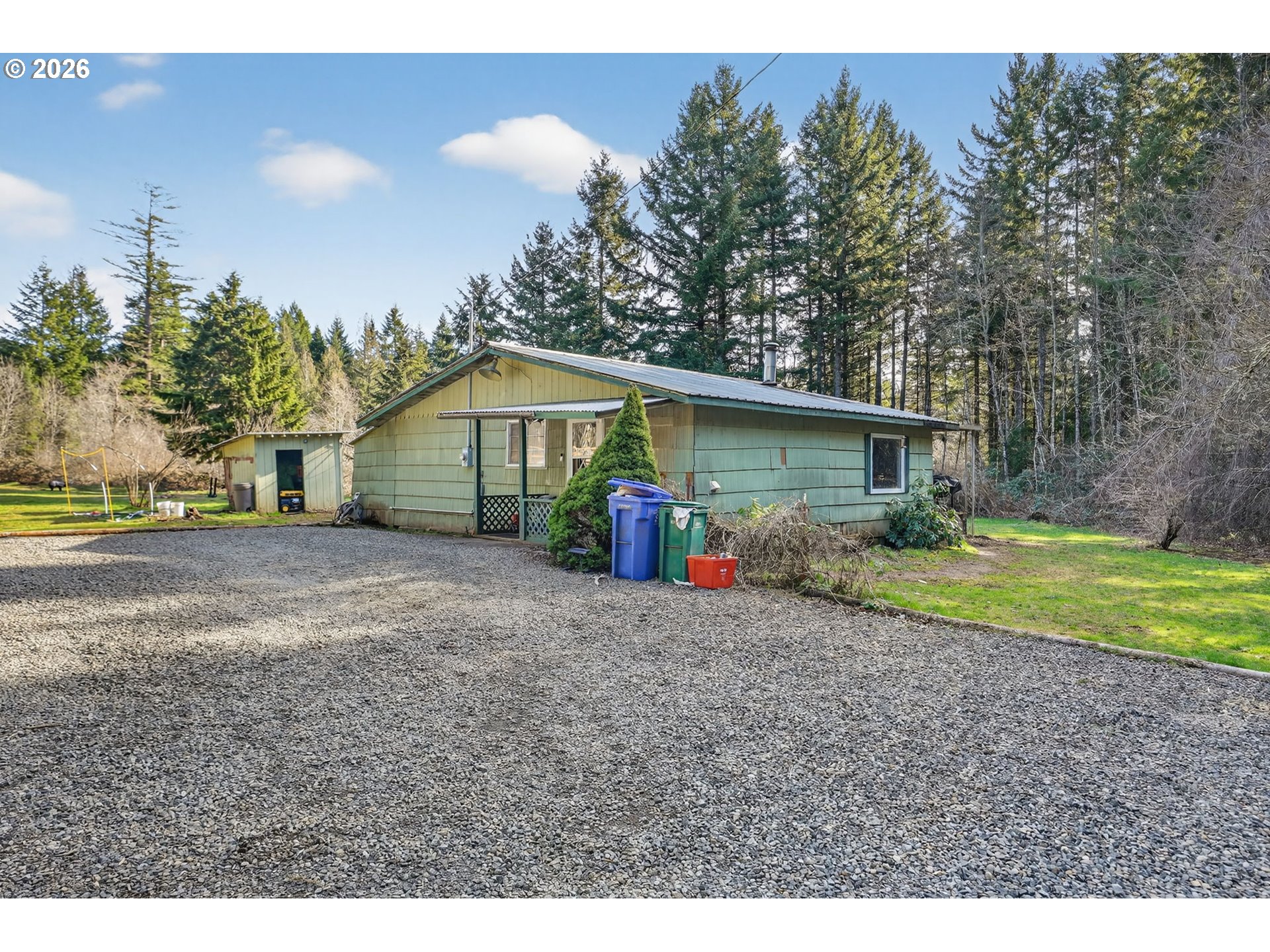 26200 Highway 211 Estacada, OR 97023 - Photo 2 of 24 a view of large house with a big yard and large trees