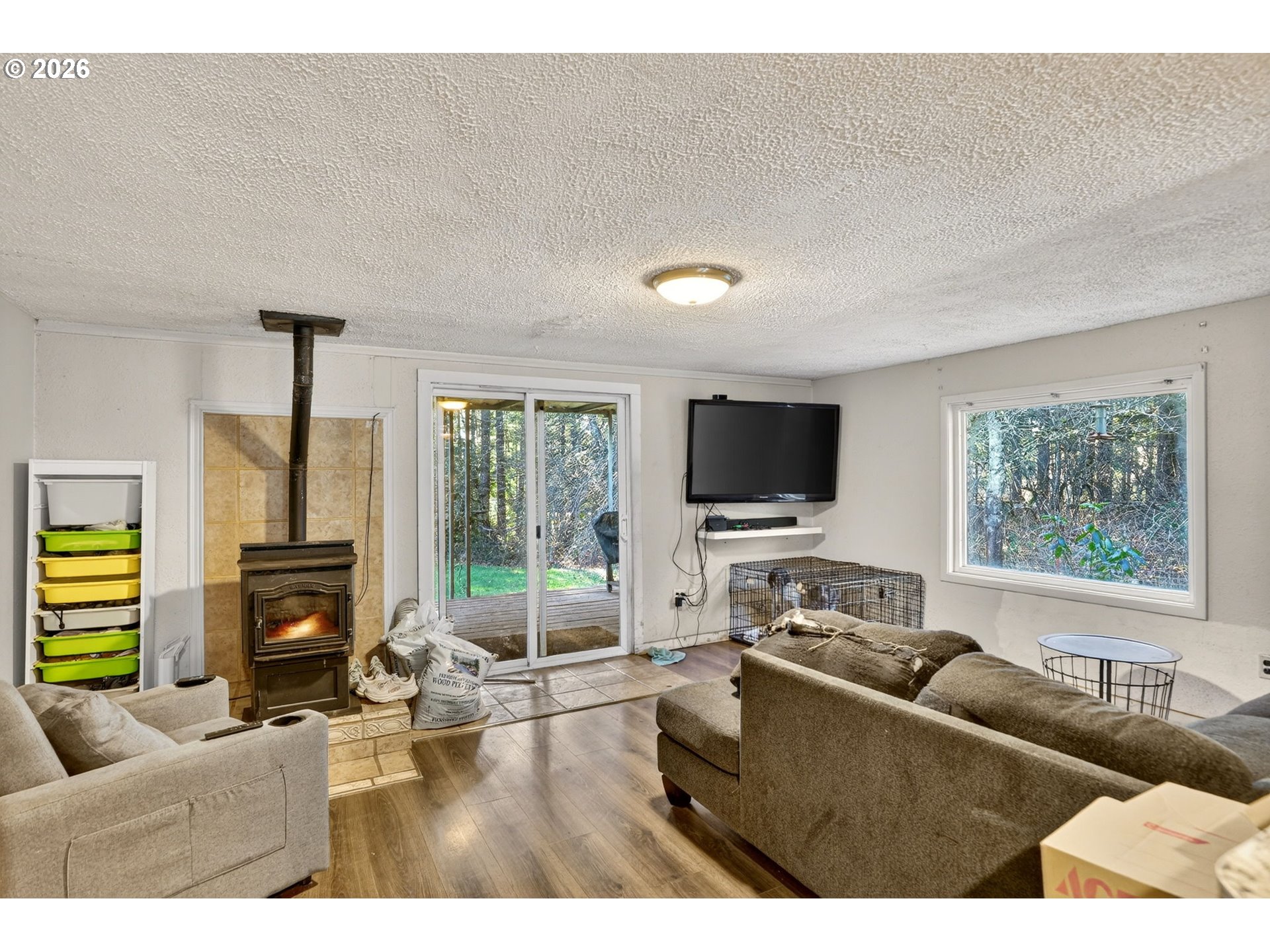 26200 Highway 211 Estacada, OR 97023 - Photo 4 of 24 a living room with furniture and a flat screen tv