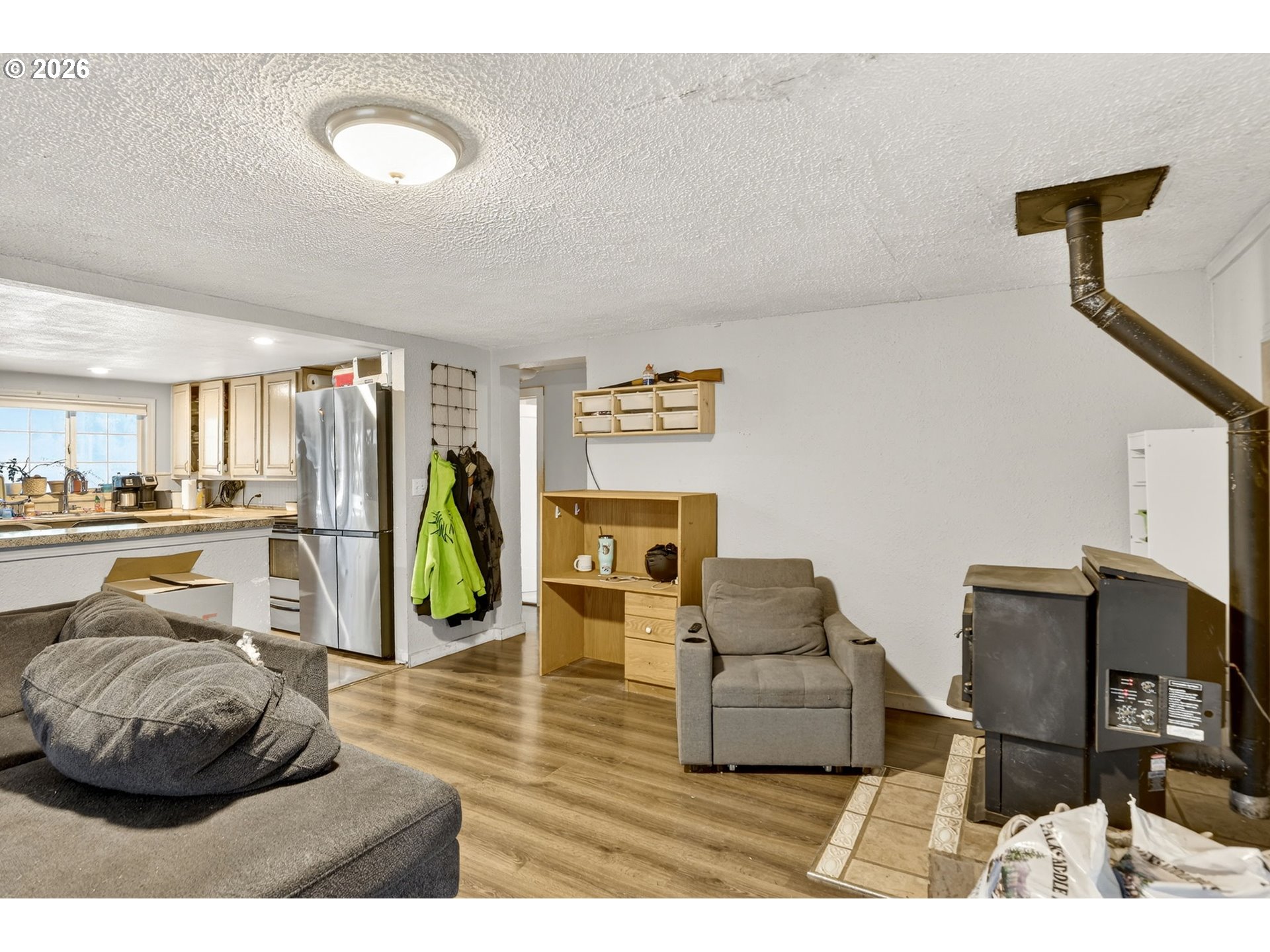26200 Highway 211 Estacada, OR 97023 - Photo 6 of 24 a living room with furniture and a wooden floor