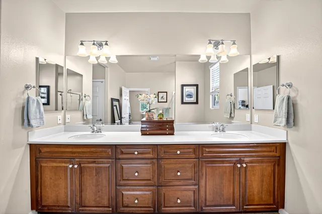 a view of a workspace with furniture and wooden floor