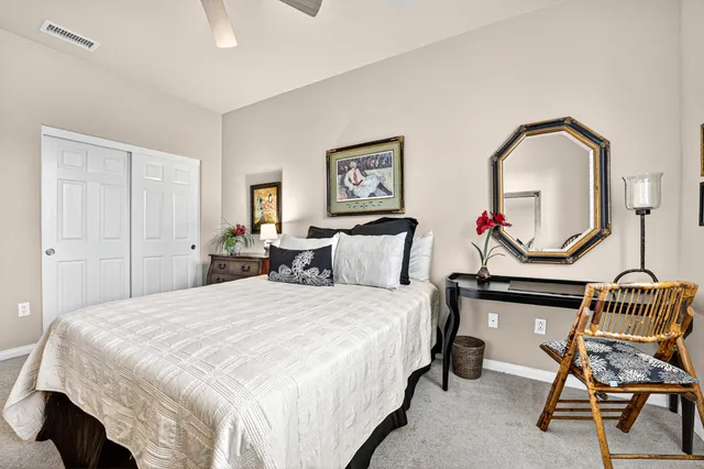 a view of a garden with wooden fence