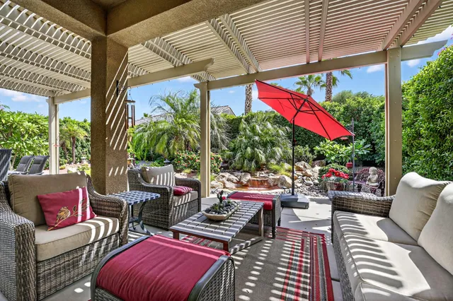 a swimming pool view with a garden space