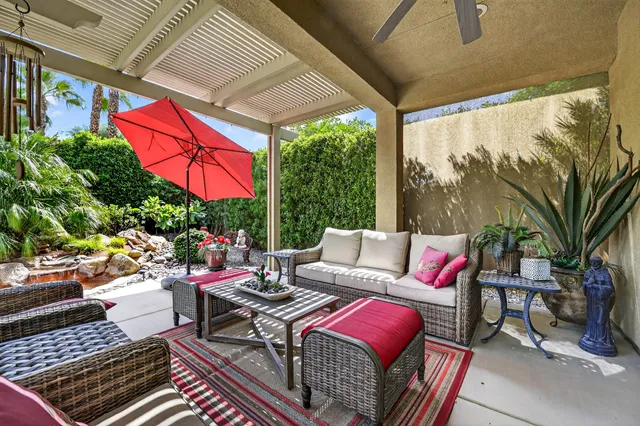 a view of an outdoor space with seating area and garden