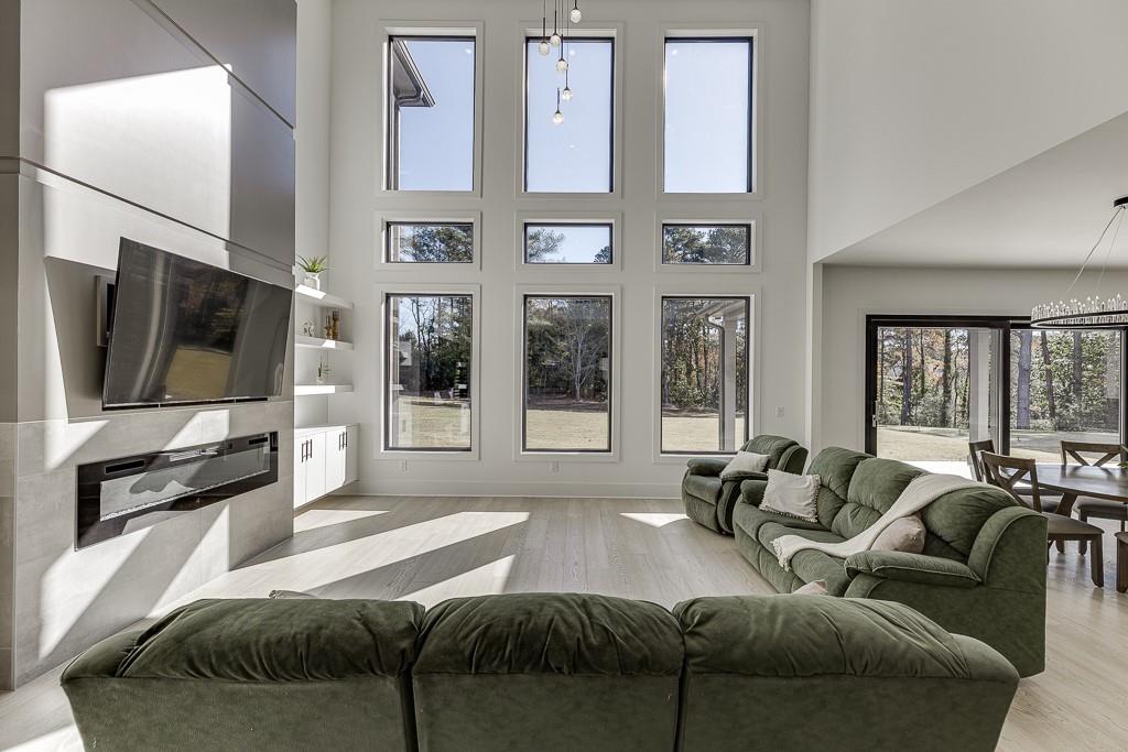 751 Rock Springs Road, Unit 2 Lawrenceville, GA 30043 - Photo 11 of 76 a living room with furniture tv and large window