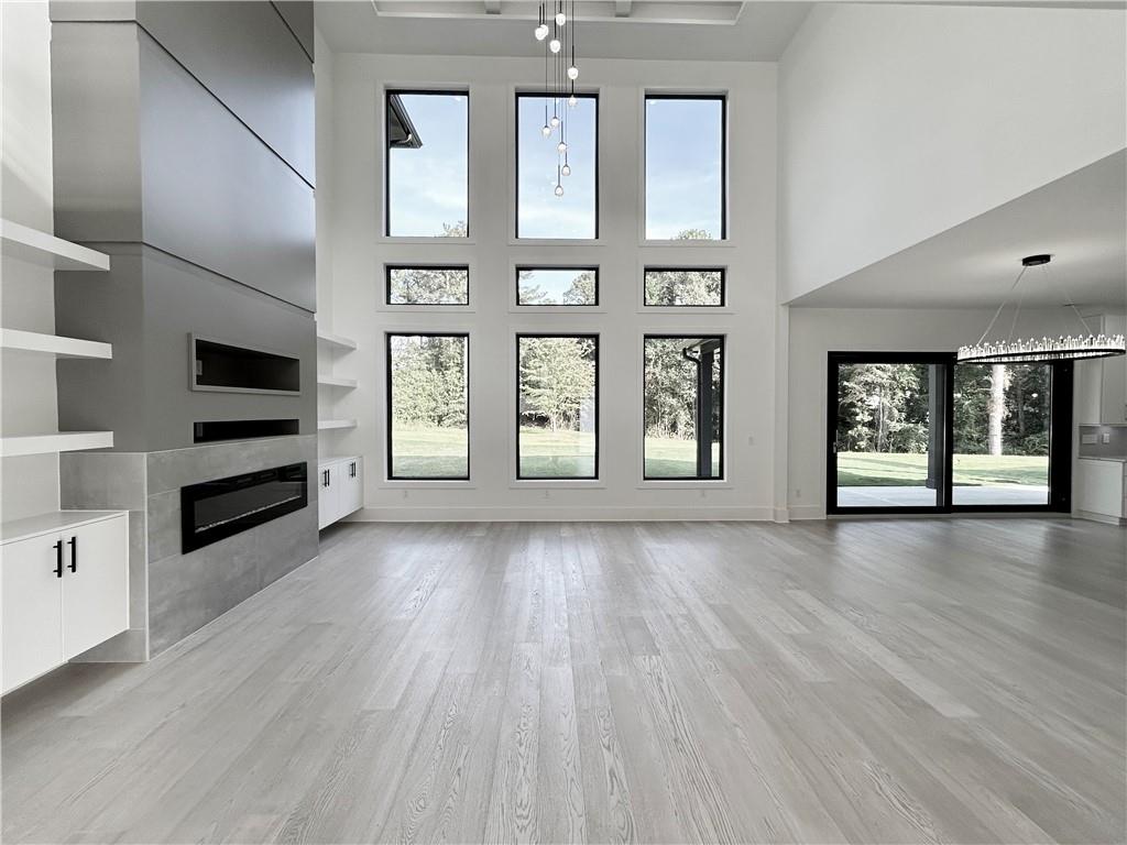 751 Rock Springs Road, Unit 2 Lawrenceville, GA 30043 - Photo 12 of 76 wooden floor in an empty room with a window