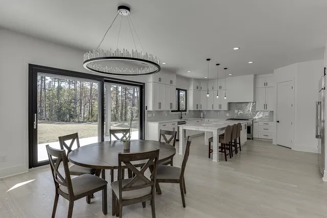 a stove top oven sitting inside of a kitchen