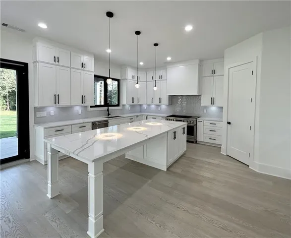 a bedroom with a bed and a ceiling fan